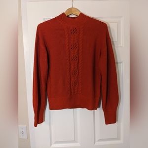 Red cable knit sweater